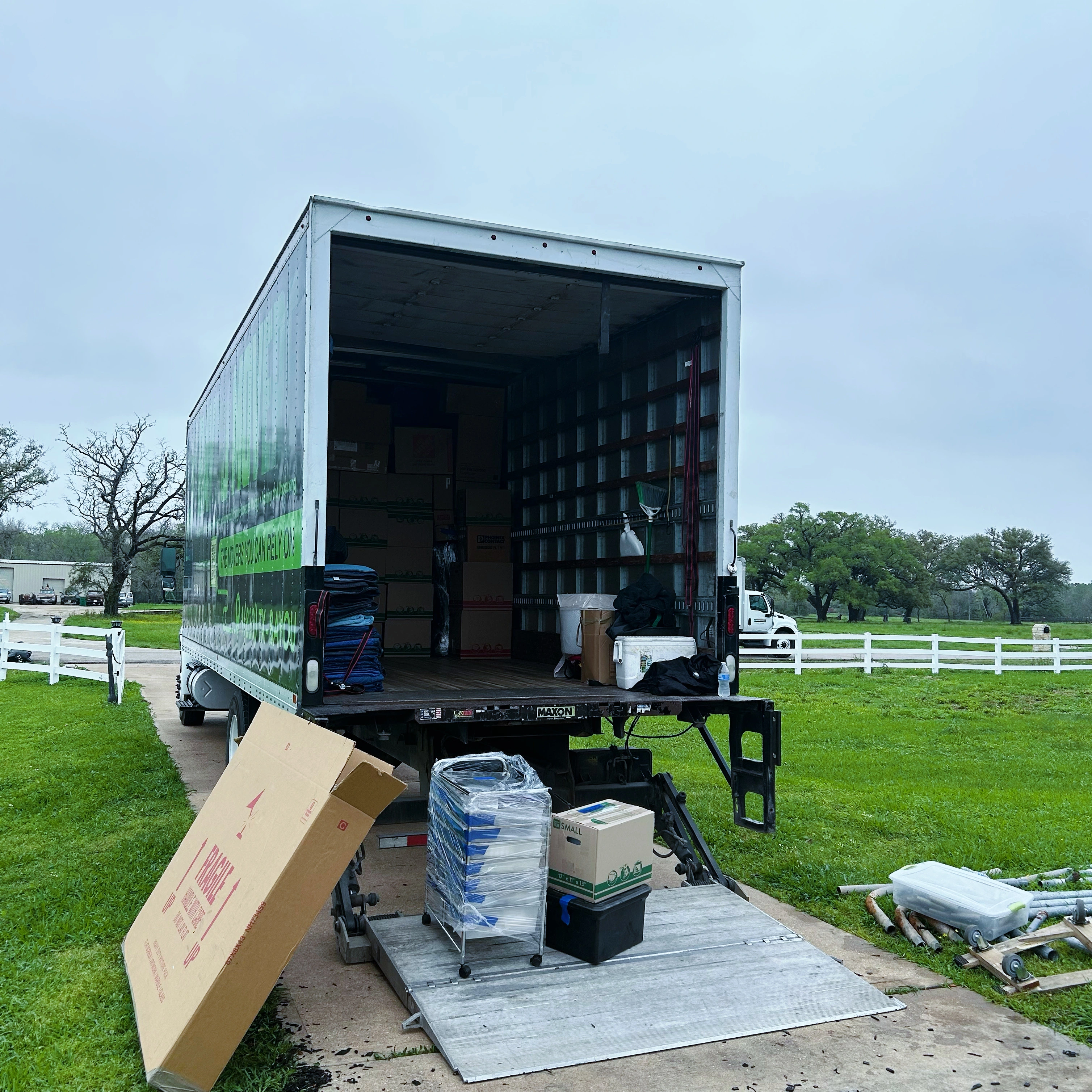 Bayou Movers packed boxes and protected moving supplies staged at the truck