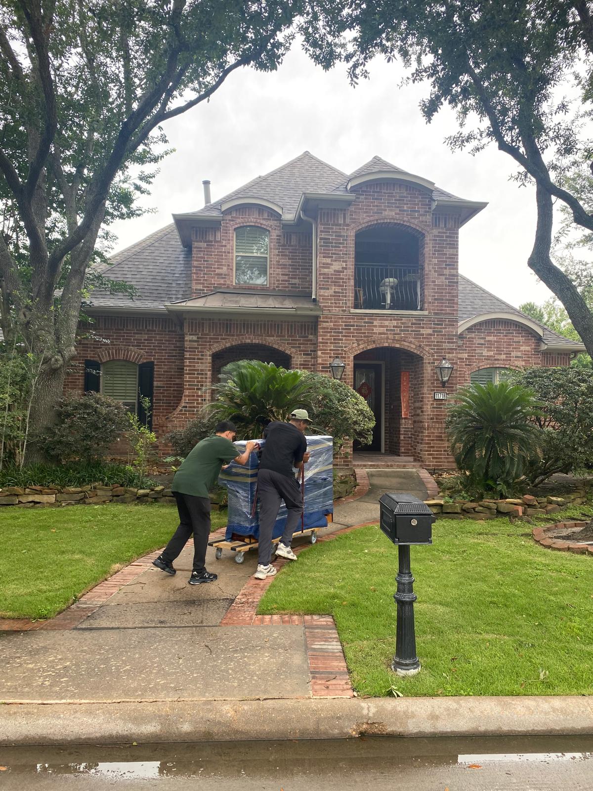 Bayou Movers residential movers carefully moving items from a Houston home