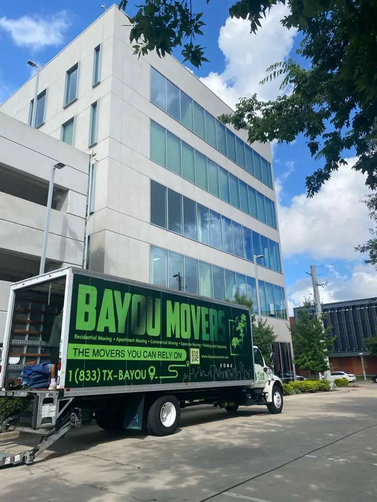 Bayou Movers commercial moving truck outside a Houston office building