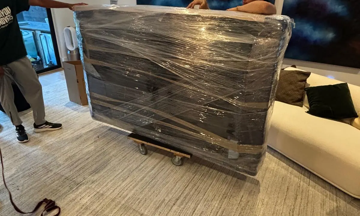 Protected and wrapped furniture prepared for a Bayou Movers move in Oak Forest, Texas